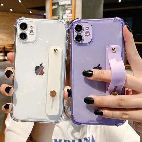 a woman holding a purple iphone case