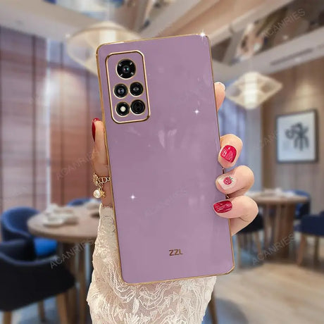 a woman holding a purple iphone case