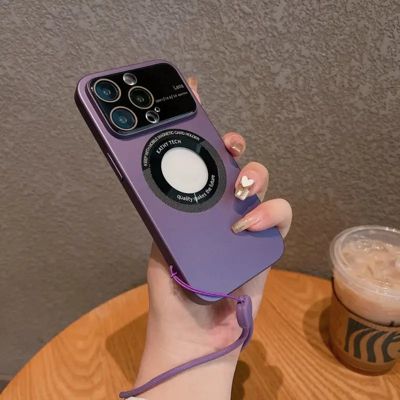a woman holding a purple iphone case with a camera attached to it