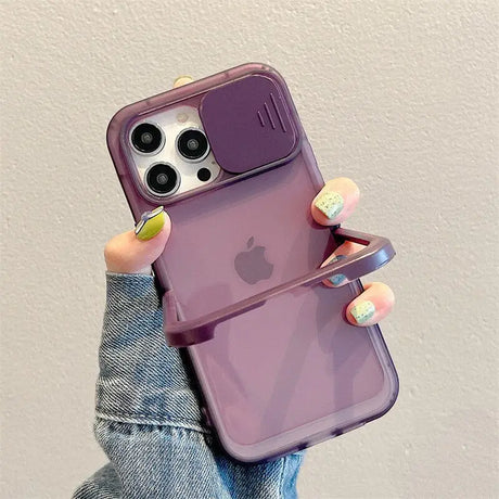 a woman holding up her phone case