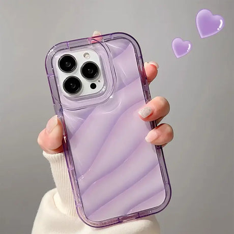 a woman holding a purple iphone case