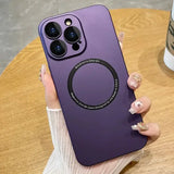 a woman holding a purple phone case with a ring on it
