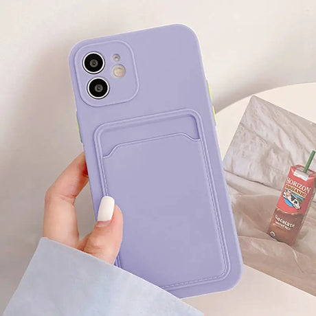 a person holding a purple phone case