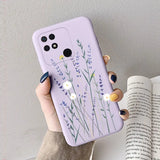 a woman holding a purple phone case with lavender flowers