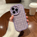 a purple phone case with a camera lens