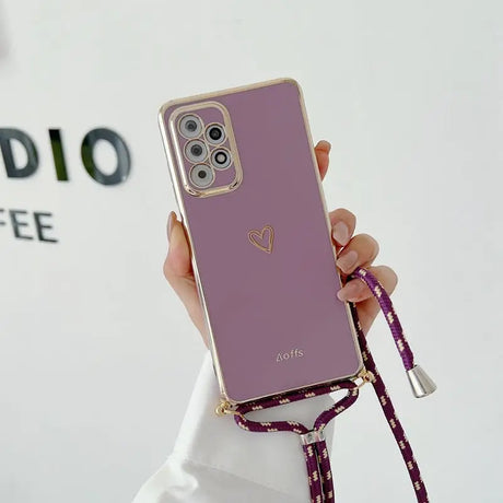 a person holding a purple phone case