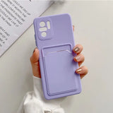 a woman holding a purple phone case