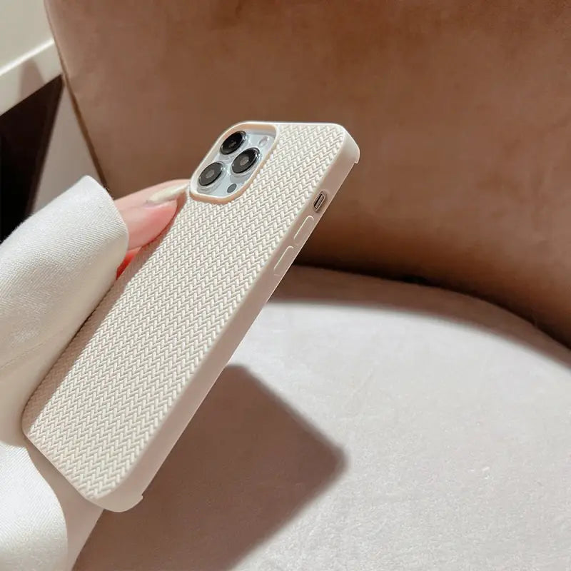 the iphone case is made from a white fabric