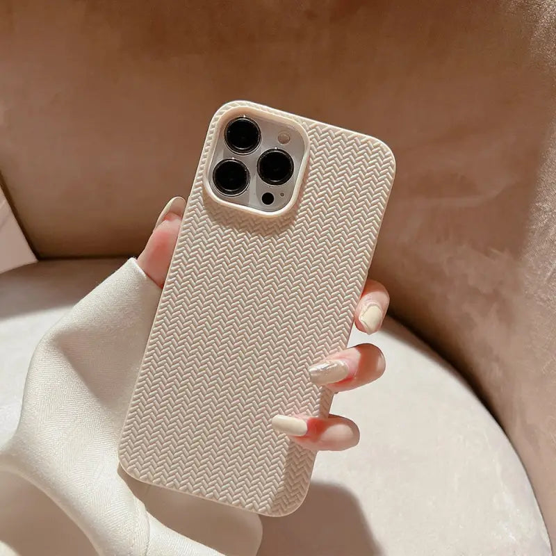 the back of a white iphone case with a white che pattern