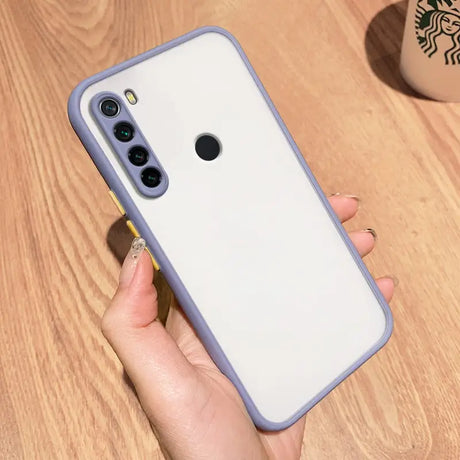 a woman holding a white iphone case