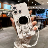 a woman holding a white phone case with a camera attached to it