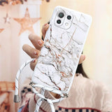 a woman holding a white phone case with marble pattern