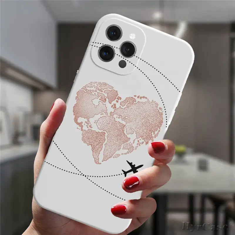 a woman holding a white phone case with a world map on it