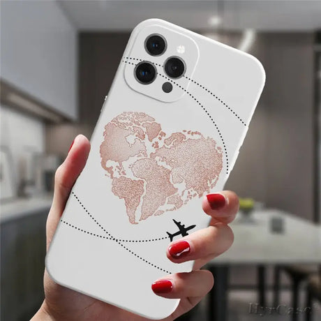 a woman holding a white phone case with a world map on it