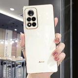 a woman holding a white phone case