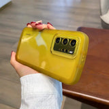 a woman holding a yellow case with a camera