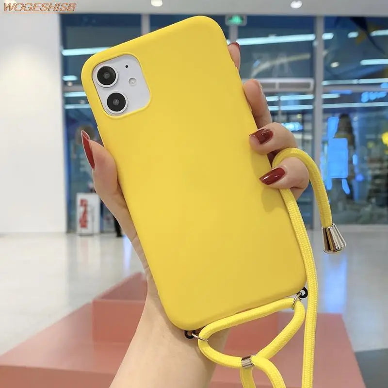 a woman holding a yellow phone case