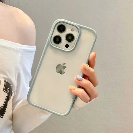 A woman holding an iphone case with a camera