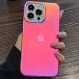 A woman holding an iphone case with a pink and blue gradient