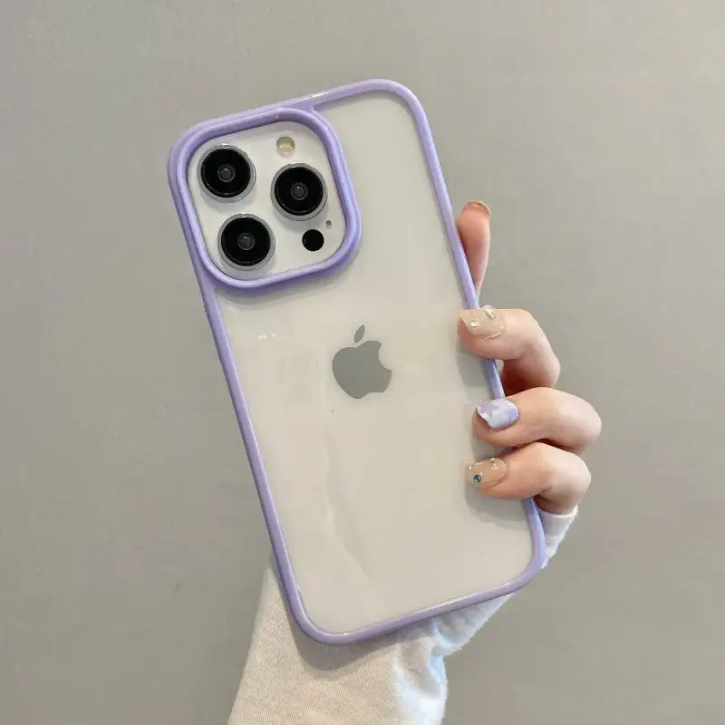 a woman holding an iphone case with a purple case
