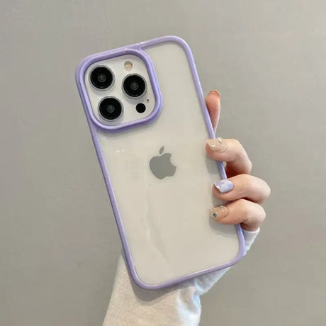 A woman holding an iphone case with a purple case