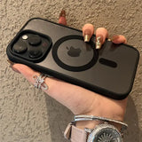 a woman holding an iphone case with a ring on it