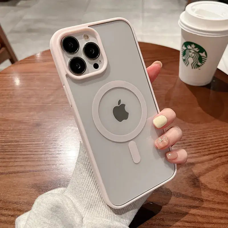 A woman holding an iphone case with a starbucks cup in the background