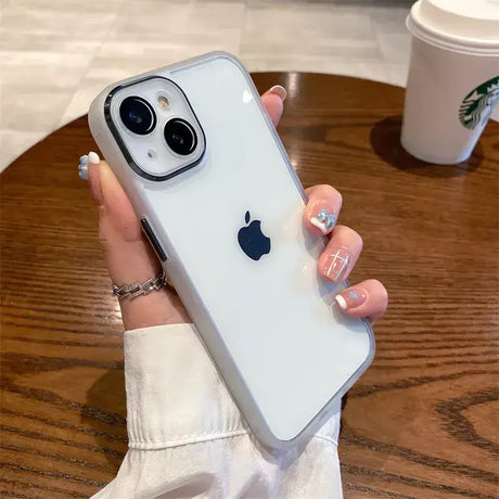 A woman holding an iphone case with a white apple logo