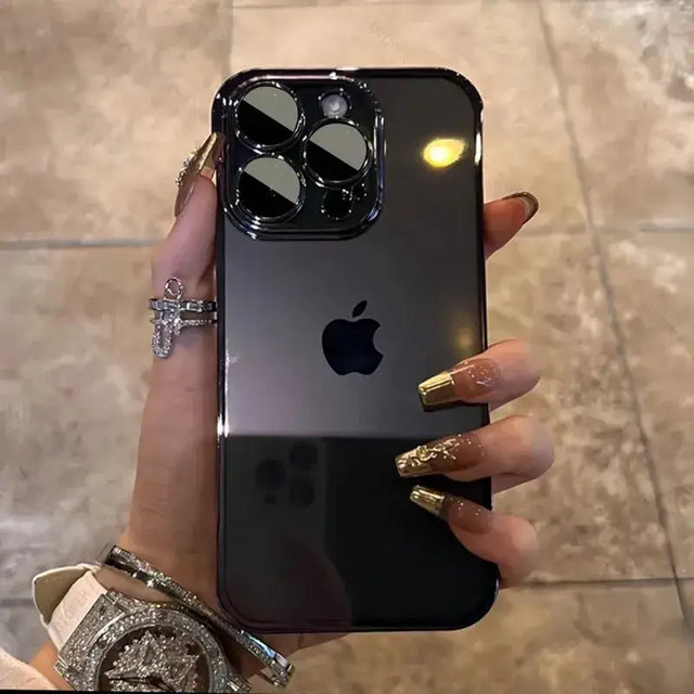 a woman holding an iphone with a diamond ring on it