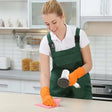 a woman cleaning a kitchen counter with a sponge