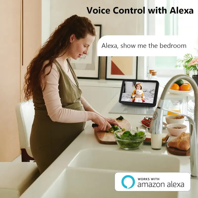 a woman sitting at a kitchen counter with a tablet