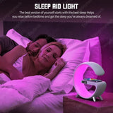 a woman laying in bed with a pink light