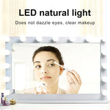 a woman is looking at her makeup in the mirror