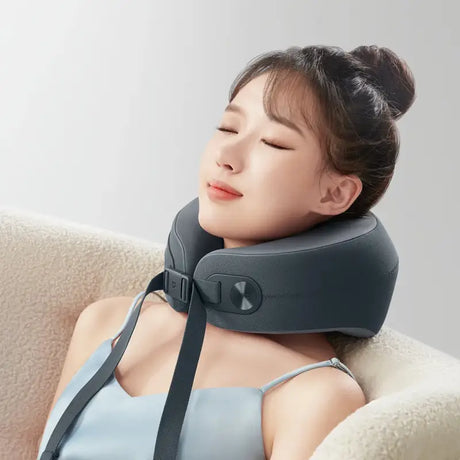 A woman wearing a neck pillow