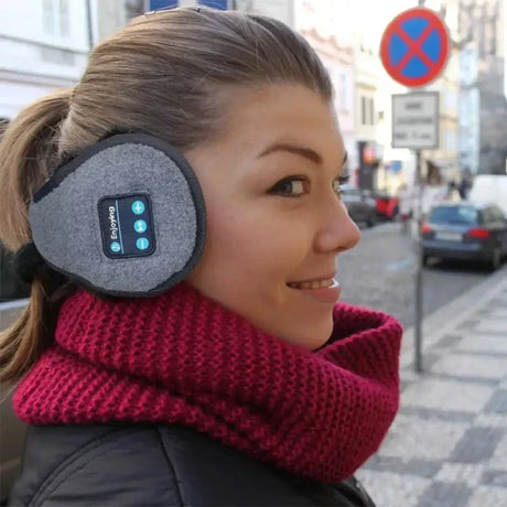 A woman wearing a pair of bluetooth wireless headphones