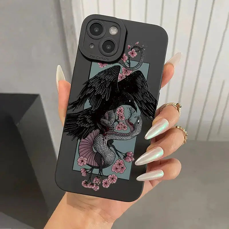 a woman holding a phone case with a bird on it