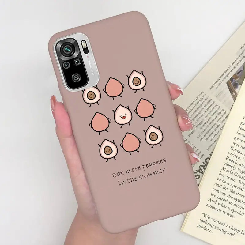 a woman holding a phone case with a bird design