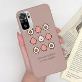 a woman holding a phone case with a bird design