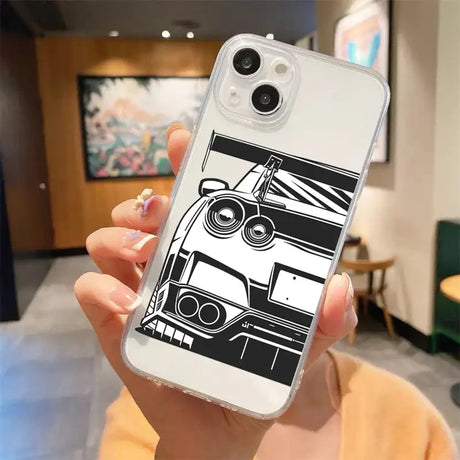 A woman holding a phone case with a black and white image of a car