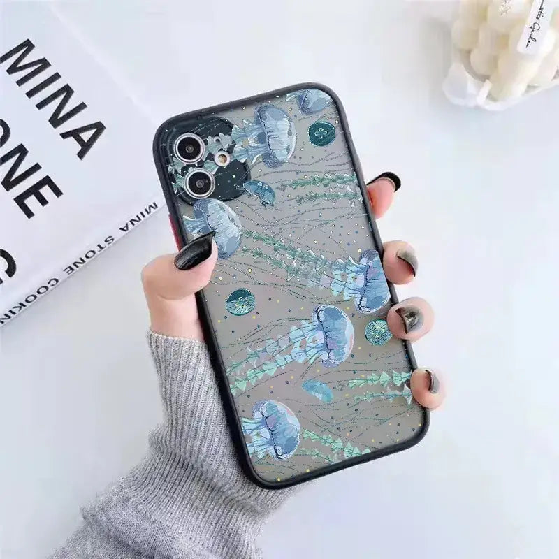 a woman holding a phone case with a blue and green marble pattern