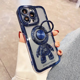 a woman holding a phone case with a blue phone
