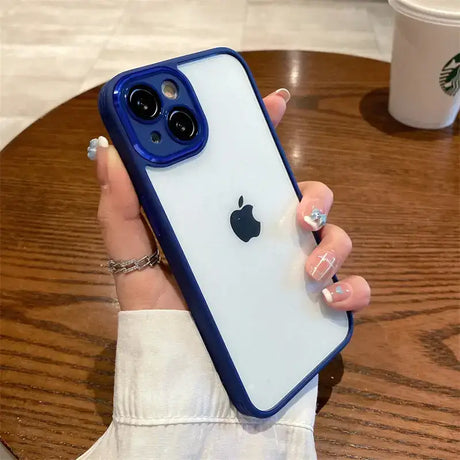 A woman holding a phone case with a blue iphone