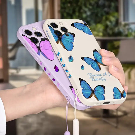 A woman holding a phone case with butterflies on it