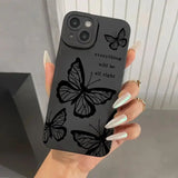 a woman holding a phone case with butterflies on it