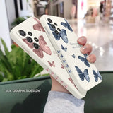 a woman holding a phone case with butterflies on it