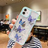 a woman holding up a phone case with butterflies on it