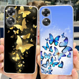 a woman holding up a phone case with butterflies on it