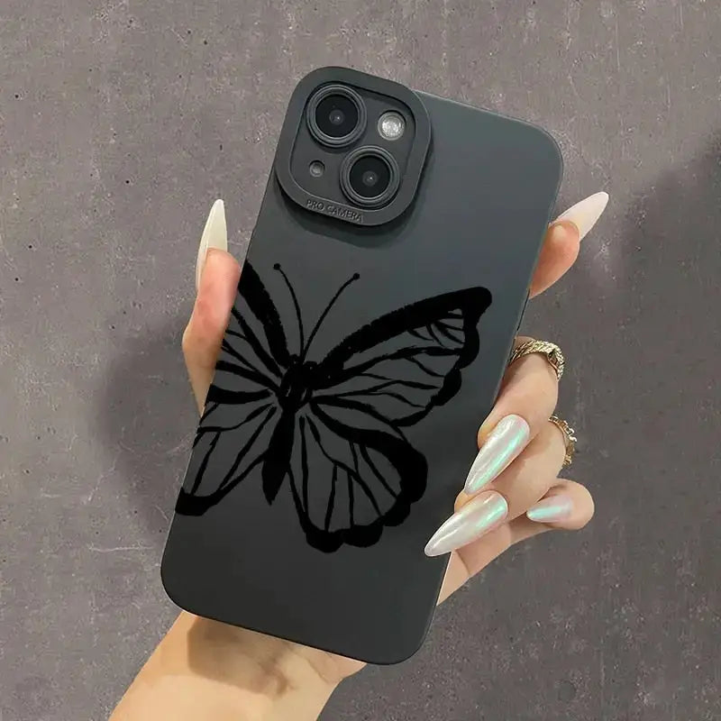 a woman holding a phone case with a butterfly on it