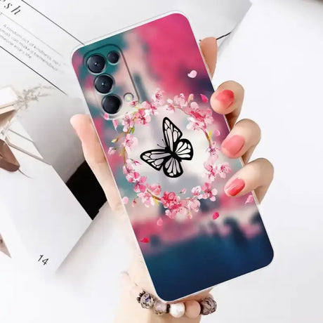 A woman holding a phone case with a butterfly on it