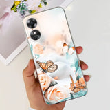 a woman holding a phone case with a butterfly and flowers on it